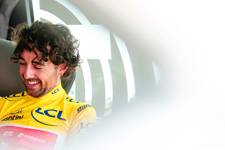 Ben Healy’s in yellow, and a team celebrates